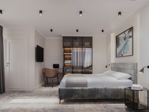 Ein modernes Schlafzimmer mit Bett, Schreibtisch, Stuhl und Kleiderschrank.