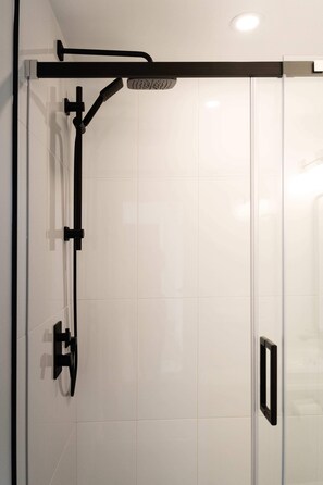 Shower, hair dryer, towels, shampoo