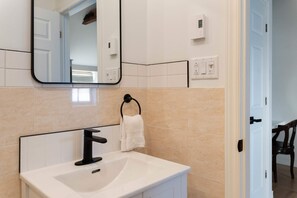Shower, hair dryer, towels, shampoo