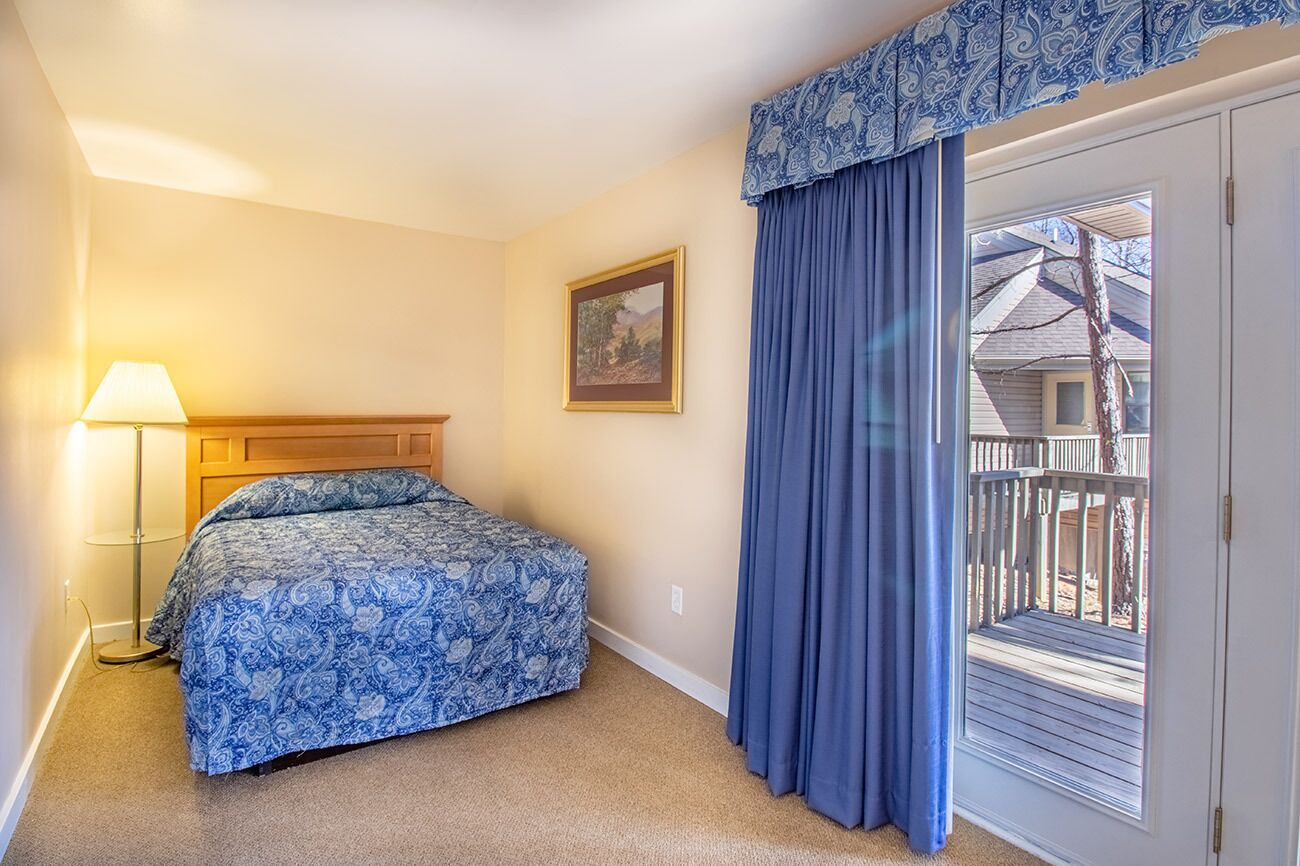 Second bedroom includes queen bed and private deck access
