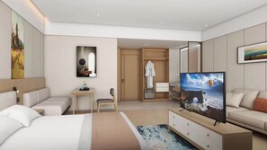 Une chambre d’hôtel moderne équipée d’un lit, d’une télévision, d’un bureau et d’un coin salon.