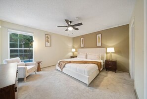 Master Bedroom with King Bed and bathroom #Disney #Parks #kingdom #springs #poolhouse #Vacation #Rental #waterpark #davenport #Kissimmee #Orlando #universal #citywalk #legoland #shortstay #longstay
