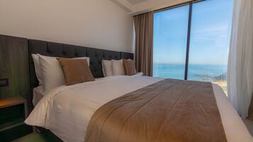 Apartemen Comfort, pemandangan laut | 3 kamar tidur, minibar, brankas, dan tirai kedap cahaya