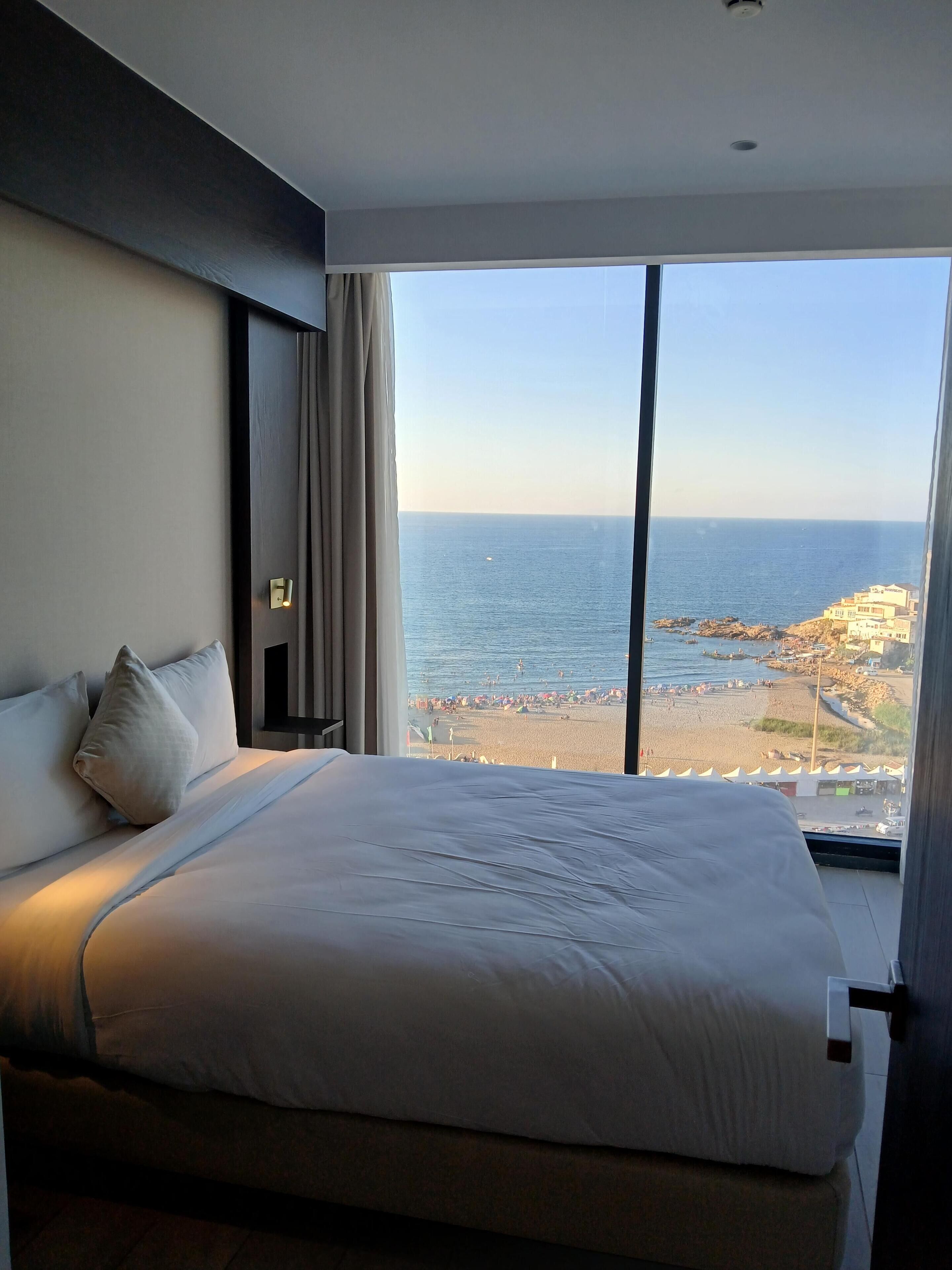 Apartamento conforto, vista para o mar | Frigobar, cofres nos quartos, cortinas blackout, quartos à prova de som