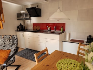 Fridge, microwave, stovetop, coffee/tea maker