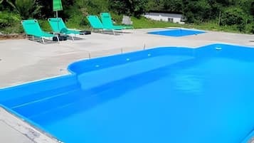 2 outdoor pools, open 8:00 AM to 11:00 PM, pool umbrellas, pool loungers