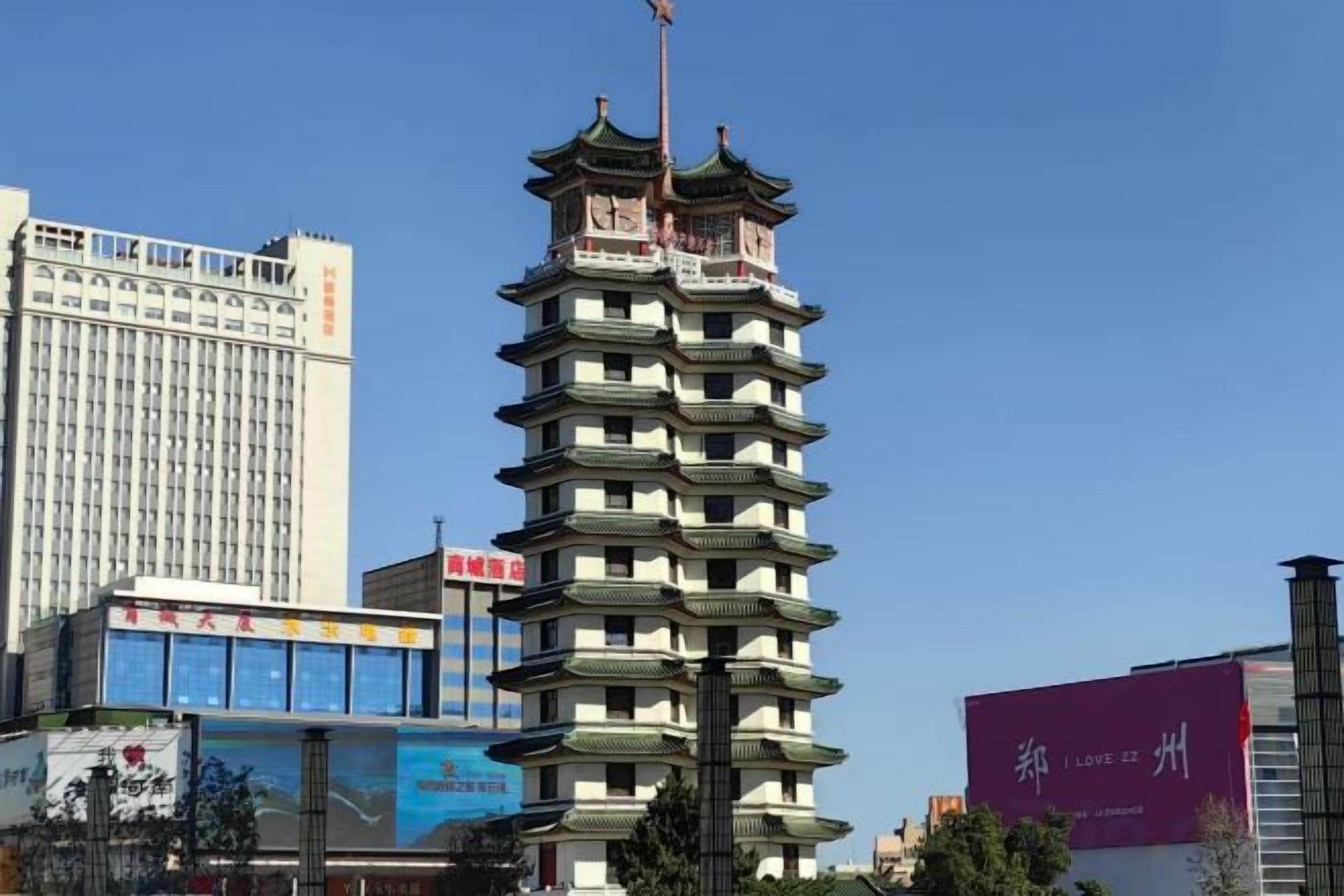 A multi-story building with a traditional architectural style, surrounded by modern high-rise buildings.