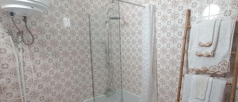 Shower, hair dryer, towels, soap