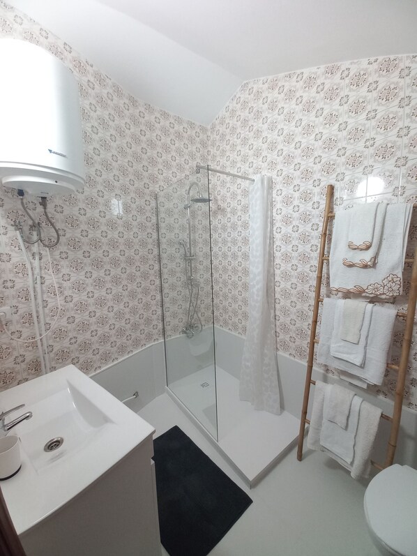 Shower, hair dryer, towels, soap