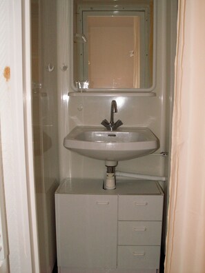 Shower, hair dryer, towels, toilet paper