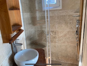 Shower, towels, soap, toilet paper