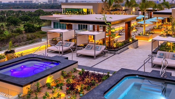 A rooftop pool area with lounge chairs and a hot tub. - Luxury Retreat, VGolf. Marina Vallarta. (Puerto Vallarta)