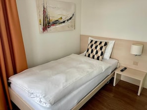 Comfort Single Room, City View | 1 bedroom, in-room safe, desk, laptop workspace