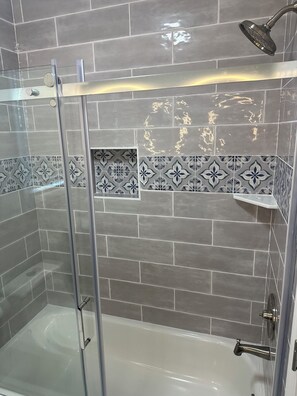 Shower, hair dryer, towels, soap