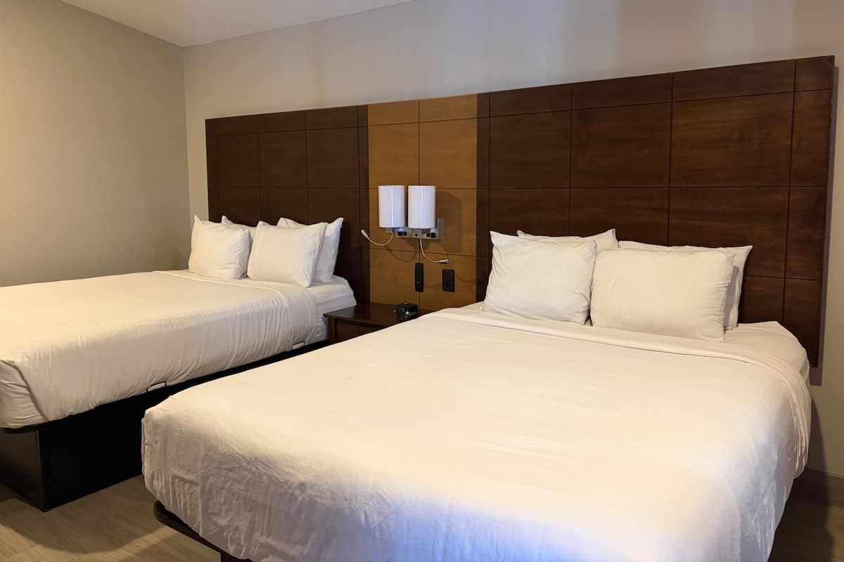 Deluxe Room, 2 Queen Beds, Non Smoking, Refrigerator & Microwave | Egyptian cotton sheets, premium bedding, down duvets, memory-foam beds