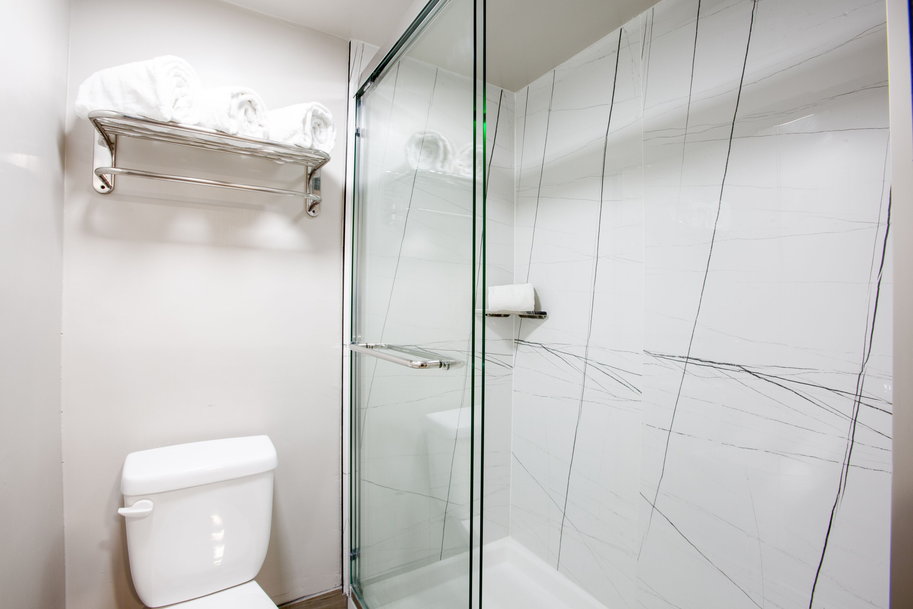 Shower, rainfall showerhead, hair dryer, towels