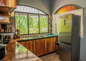 Microwave, coffee/tea maker, blender, cookware/dishes/utensils