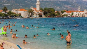 A coastal town with a beach, clear blue waters, and a prominent church tower. - Modern apartment Nikola in a quiet area (Kaštel Stari)