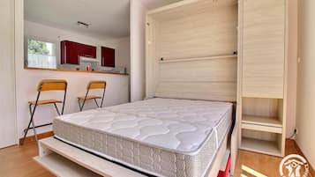 Iron/ironing board, travel crib, free WiFi, bed sheets