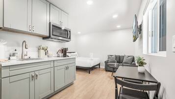 Fridge, microwave, stovetop, coffee/tea maker