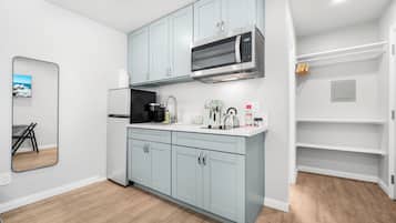 Fridge, microwave, stovetop, coffee/tea maker