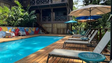 Outdoor pool, pool umbrellas, sun loungers