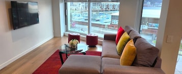 Deluxe Apartment, 3 Bedrooms, Private Bathroom, Bay View | Living area | 55-inch Smart TV with digital channels