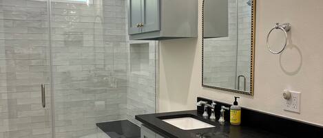 Shower, hair dryer, towels, soap