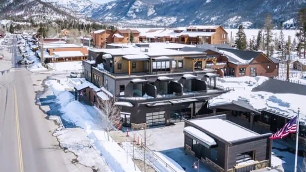 A hotel with a modern architectural design, featuring a central courtyard and multiple levels.