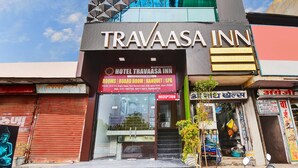 A hotel named Travaasa Inn with a signboard indicating amenities like rooms, board room, banquet, and spa. - Hotel Travaasa Inn (Jaipur)