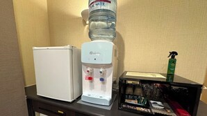 A minibar with a refrigerator, a water dispenser, and a coffee machine. - HOTEL EN (Yokohama)