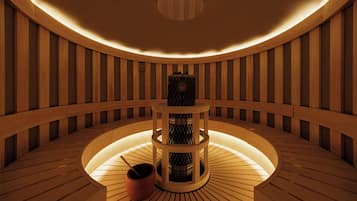 A circular wooden room with a central table and a small heater.