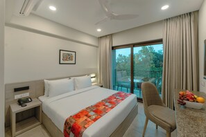 In-room safe, desk, laptop workspace, blackout curtains - Comfort Inn Elite Goa (Panaji)