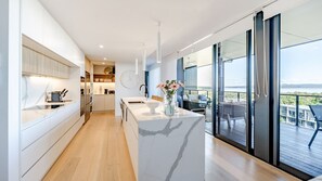 Fridge, microwave, oven, stovetop - The Hamptons Lake House Noosa Heads Luxury House (Noosa)