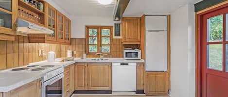Fridge, stovetop, dishwasher, coffee/tea maker
