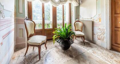 Elegant 350 sqm apartment for 6 people, located on two levels of a historic 18th century villa. The villa, with fine furnishings and frescoed galleries, will enchant you with its rooms, where history and comfort blend to give you an unforgettable experie