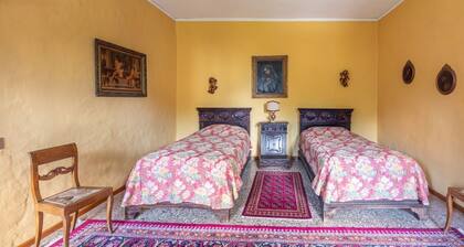 Elegant 350 sqm apartment for 6 people, located on two levels of a historic 18th century villa. The villa, with fine furnishings and frescoed galleries, will enchant you with its rooms, where history and comfort blend to give you an unforgettable experie