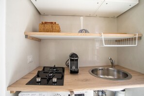 Fridge, stovetop, coffee/tea maker, cookware/dishes/utensils