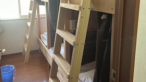 A bunk bed room with a wooden ladder and a window. - Guesthouse Aizu - Hostel (Tanabe)