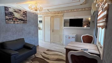 Comfort Apartment, Courtyard View | Living area | 50-cm TV with satellite channels