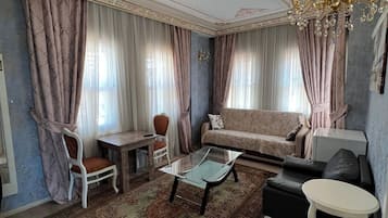 Comfort Apartment | Living area | 50-cm TV with satellite channels
