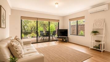 Deluxe House, Multiple Beds, Non Smoking | Living area | 55-inch TV with digital channels, DVD player