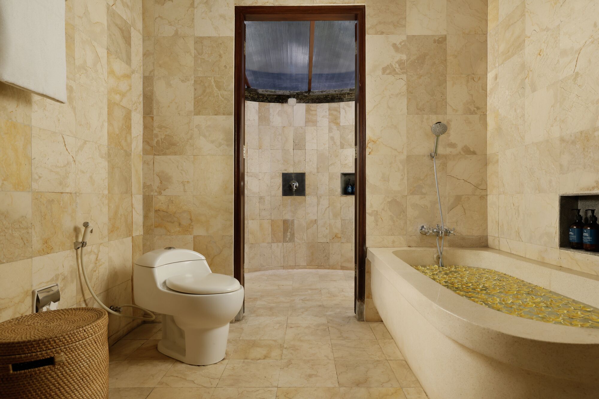 A bathroom with a toilet, a shower, and a bathtub.