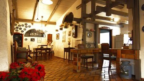 A cozy interior with a brick floor, wooden furniture, and a kitchen area with a refrigerator and sink. - Detached Holiday Home in Medelby (Medelby)