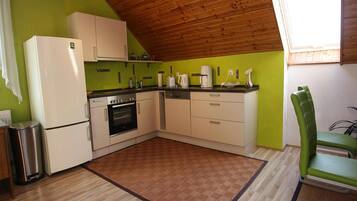 Apartment | Private kitchen | Stovetop, electric kettle, toaster, high chair