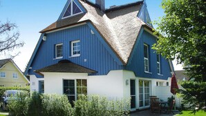 A two-story house with a steeply pitched roof and a triangular gable. - Semi-detached House, Zingst (Zingst)