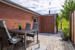 Apartamento | Restaurante al aire libre