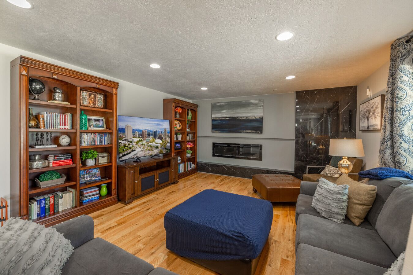 Smart TV, fireplace, books, printers