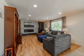 Smart TV, fireplace, books, printers