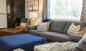 Smart TV, fireplace, books, printers